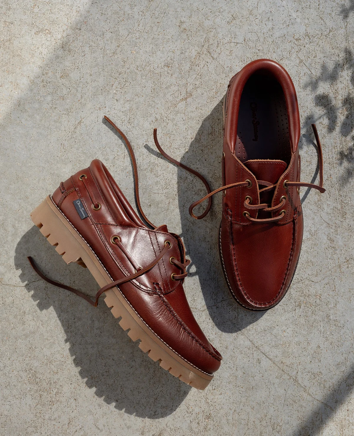 Brown leather lace-up shoes with contrasting pale soles