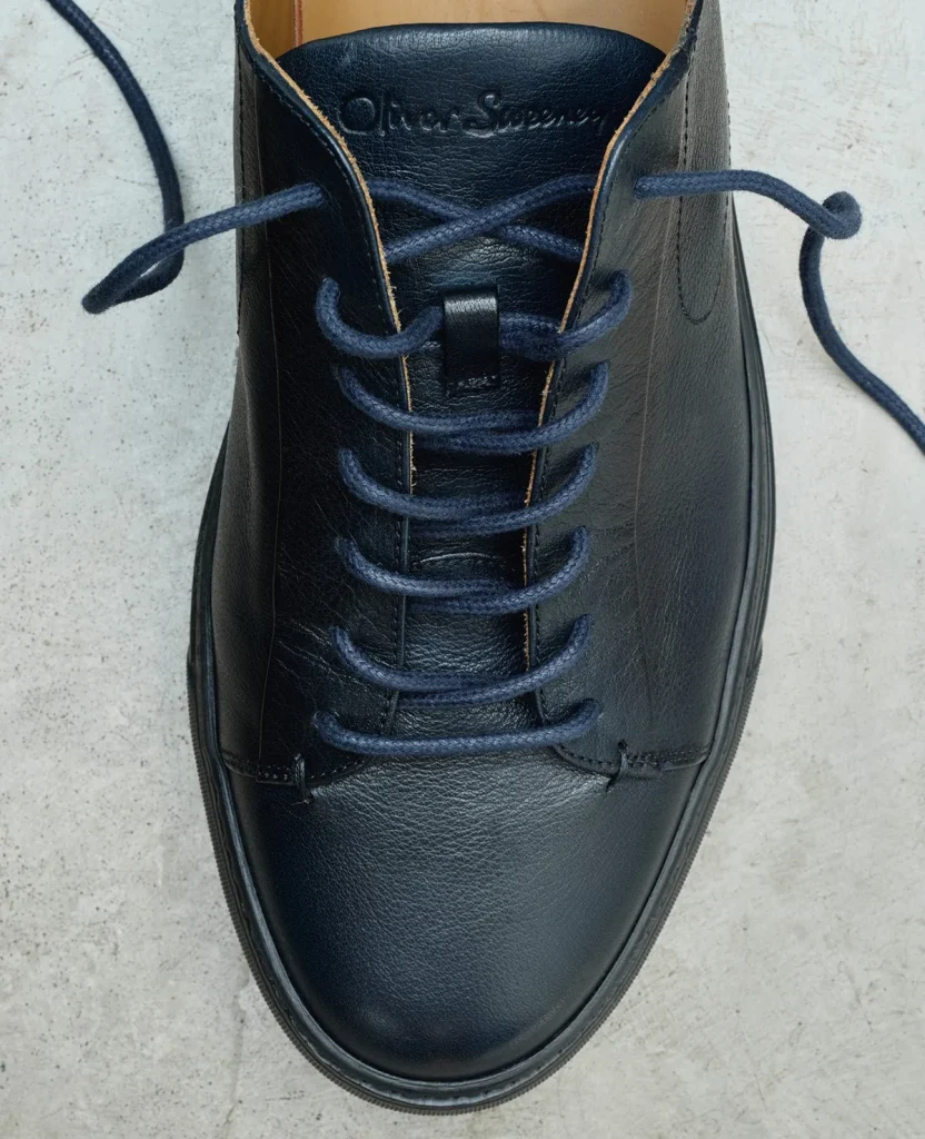 Close-up of a dark leather lace-up shoe
